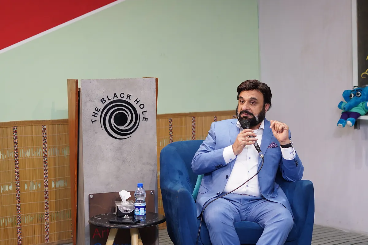 Dr Mohammad Muneeb Khan speaking at the launch of the children's comic Elephants in the Room.